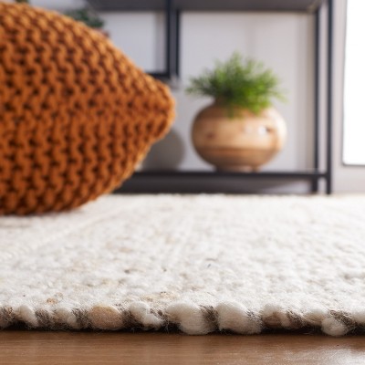 Ivory and Beige Handwoven Wool Area Rug with Tassels, 3' x 5'