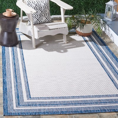 Ivory and Navy Rectangular Synthetic Indoor/Outdoor Rug
