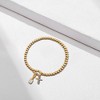 Free bird Cross Birthstone Bracelet | Dainty 14K Gold Plated Cross Charm Bracelet | Stretchable Elastic Gold Beaded Bracelet - 4 of 4