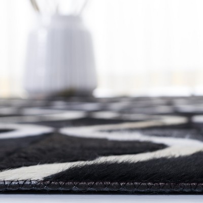Hand-Knotted Black and Beige Geometric Cowhide Rug