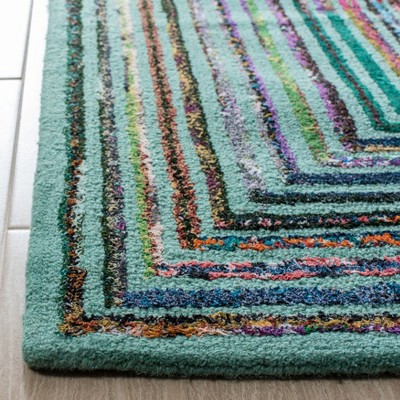 Hand-Tufted Teal Wool Round Accent Rug - 47"