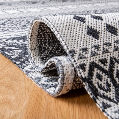 Augustine Black and Cream Geometric Flat Woven Area Rug