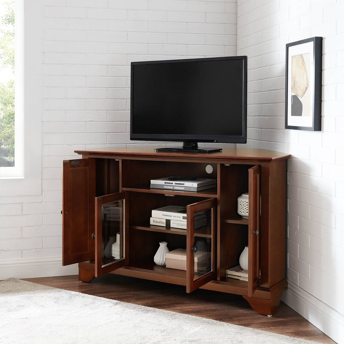 TV console with TV on top in a living room