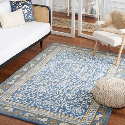 Blue and Ivory Hand Tufted Wool Area Rug 5' x 8'