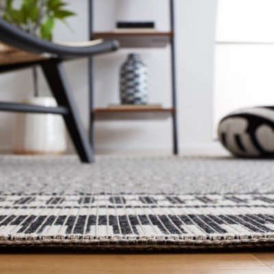 Ivory and Black Geometric Flat Woven Area Rug