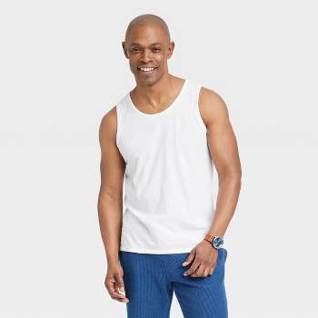 Royalty-Free photo: Man wearing white tank top and black fitted pants