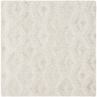 Ebony EBN921 Handmade Tufted Rug - Safavieh
