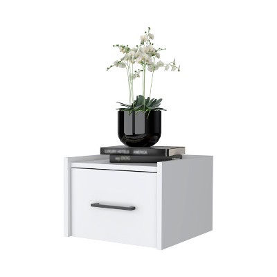 Nightstand with vase and books on top