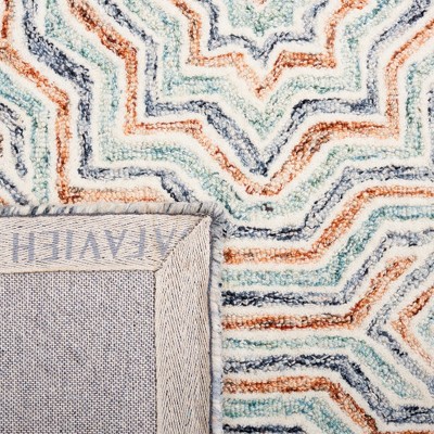 Capri Blue and Rust Hand-Tufted Wool Area Rug 6' x 9'