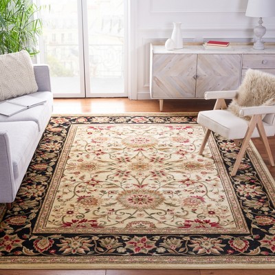 Ivory Tufted Handmade 6' x 9' Rectangular Synthetic Rug