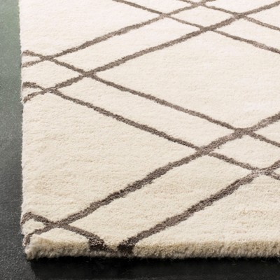 Hand-Tufted Artisan Square Wool Rug in Rich Brown