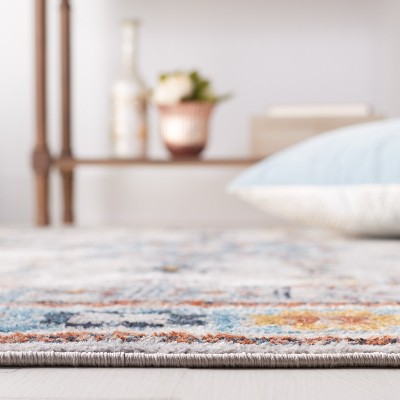 Celestial Swirl 63" Blue and Red Synthetic Round Rug