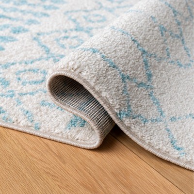 Ivory and Turquoise Moroccan Geometric 8' x 10' Area Rug