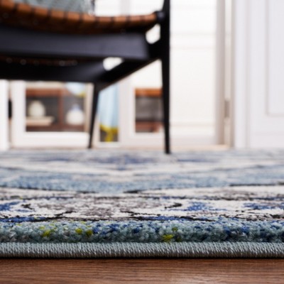 Blue and Ivory Synthetic Persian Area Rug, 5'3" x 7'6"