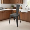 Dyonery 4 black metal chairs, with multi-hole seat designs and backrest arcs that conform to the curves of the human back - 2 of 4