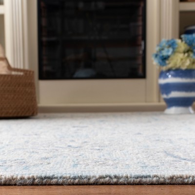 Elegant Light Blue & Ivory Wool 9' x 12' Hand-Tufted Area Rug