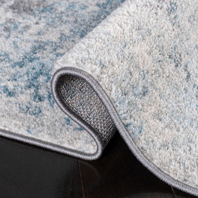 Boho-Chic Ivory/Blue Synthetic 9' x 12' Reversible Area Rug