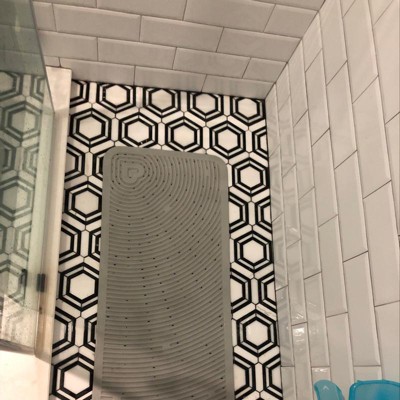 Brown spots around where a bath mat used to be YEARS ago - There's no musty  smell, it's solid on the tile and it doesn't come off when you leave a  clorox