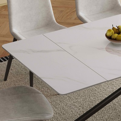 Edge and surface of the table with three chairs in background