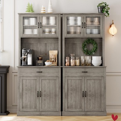 Pair of matching gray kitchen cabinets with glass doors and storage