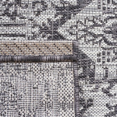Courtyard Round Non-Slip Gray Synthetic Area Rug, 6'7" x 9'6"