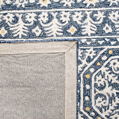 Handmade Blue and Ivory Tufted Wool Area Rug