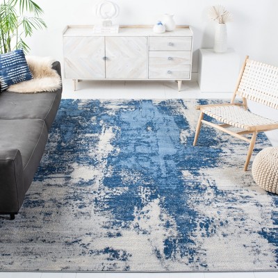 Blue and Ivory Abstract Synthetic Area Rug, 5'3" x 7'6"
