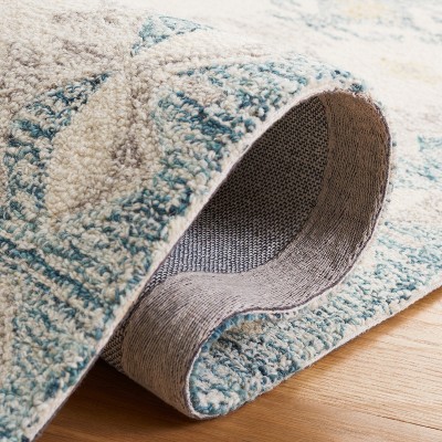 Handmade Blue and Ivory Wool 4' x 6' Tufted Area Rug