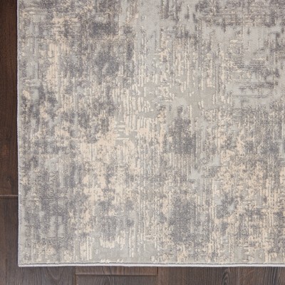 Ivory Abstract Power-Loomed Synthetic 5'3" x 7'3" Area Rug