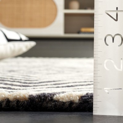 Ebony 3' x 5' Black and Ivory Hand Tufted Wool Area Rug