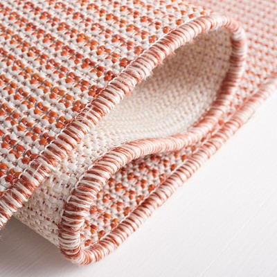 Beige and Terracotta Tufted Rectangular Synthetic Rug