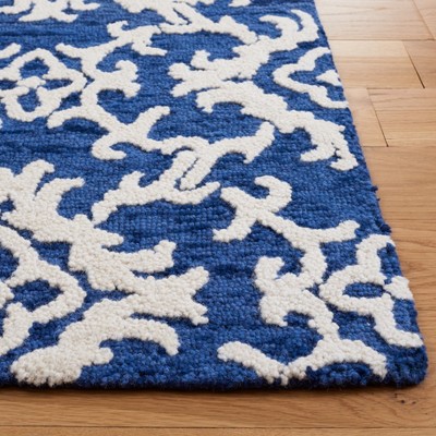 Ivory and Navy Hand Tufted Wool 4' x 6' Area Rug