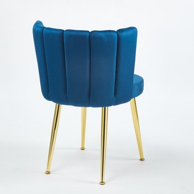 Rear view of blue velvet dining chair with gold legs