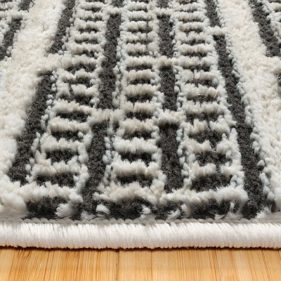 Missha Dario Beige Black Tufted Synthetic 6' x 9' Area Rug