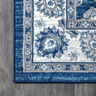 Ivory and Blue Floral Synthetic 4' x 6' Area Rug