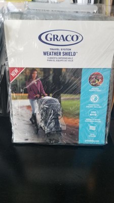 Travel system weather outlet shield