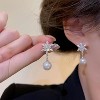 Christmas Snowflake Stud Earrings, Sparkling CZ & Pearl Design in Silver Tone. - 2 of 4