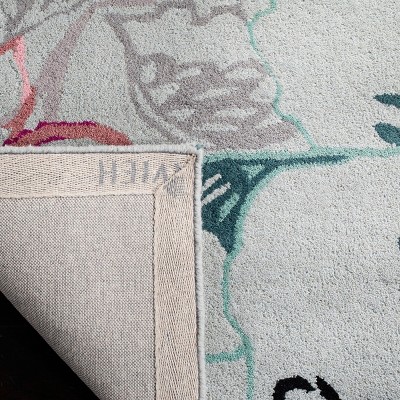 Blue and Multicolor Floral Wool 6' x 9' Handmade Rug