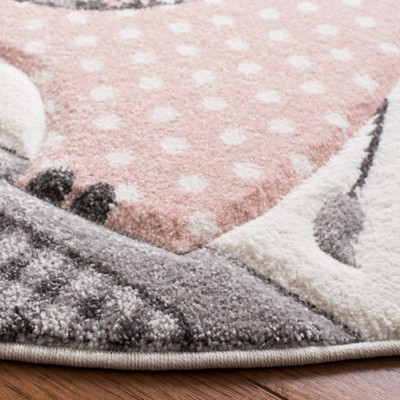 Carousel Kids Round Pink and Ivory Synthetic Area Rug