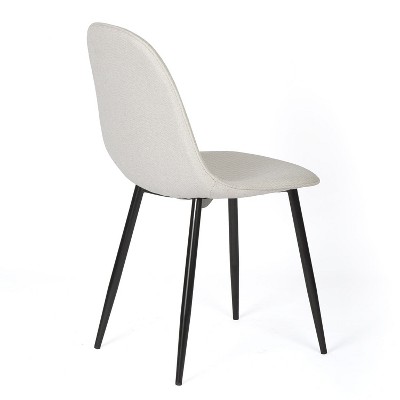 Beige upholstered dining chair side angle