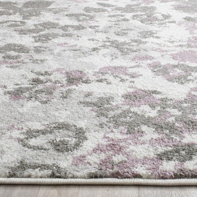 Ivory and Purple Floral Synthetic 10' x 14' Area Rug