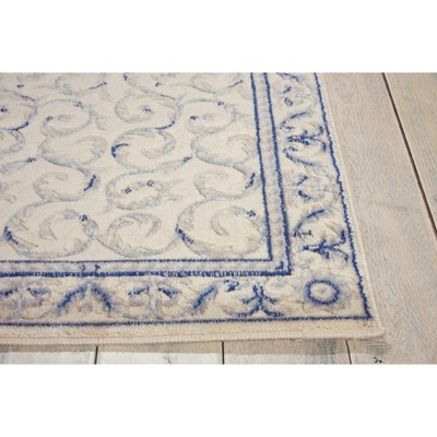 Ivory and Blue Rectangular Synthetic Area Rug
