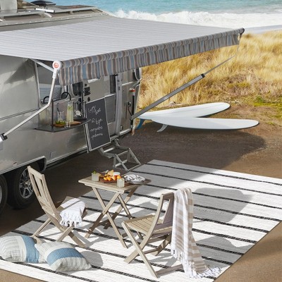 Ivory and Black Striped Synthetic 4' x 6' Indoor/Outdoor Rug