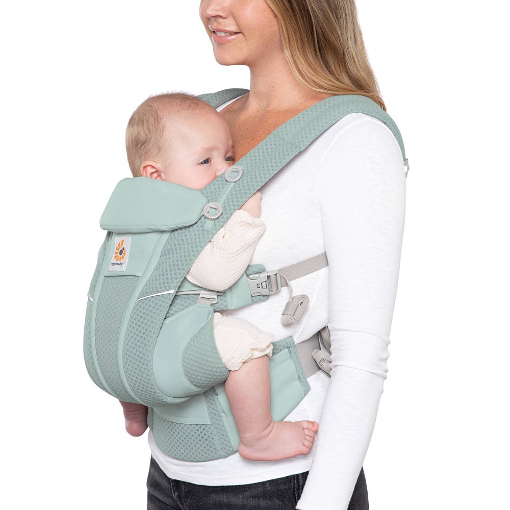 Ergobaby Omni Breeze All-Position Mesh Baby Carrier - Breeze Sage The Ergobaby Omni™ Breeze brings breathability to the next level.  When you’re wearing your baby, the key to comfort is breathability.  Rated #1 in Airflow* when tested with comparable carriers, the Omni Breeze uses SoftFlex™ Mesh fabric to maximize airflow, keeping you and your baby dry all day.   This versatile carrier provides four convenient carry positions (inward, forward, hip and back) and adjusts to ergonomically grow from newborn to toddler (0-48 months; 7-45lbs).   Innovative sliders effortlessly allow you to switch baby from inward to forward mode quickly and easily.   With padded lumbar support and extra-cushioned crossable shoulder straps, the Omni™ Breeze gives you and your baby ergonomic support in all the right places.  Includes incorporated side pockets, a detachable storage pocket as well as a UPF baby hood for sun protection, privacy and easy breastfeeding- this carrier has it all.  Ergobaby stands by our products with our ErgoPromise Guarantee. If you find a manufacturing or material defect, Ergobaby will replace your carrier at no charge.  *Compared to other leading mesh carriers.  Based on NPD data, June 2020. Color: Sage.