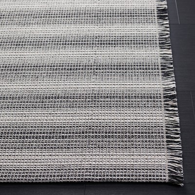 Ivory and Black Flat Woven 4' x 6' Synthetic Area Rug
