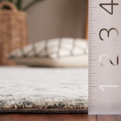 Ivory Tufted Handmade Wool 6' x 9' Area Rug