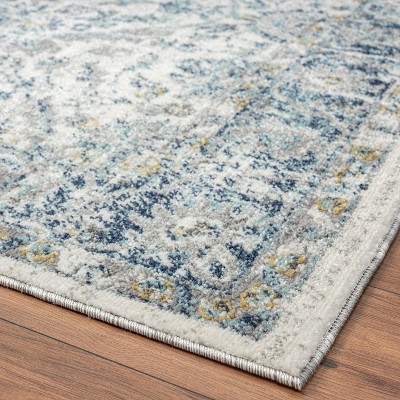Ivory and Blue Oriental Synthetic 8' x 10' Area Rug