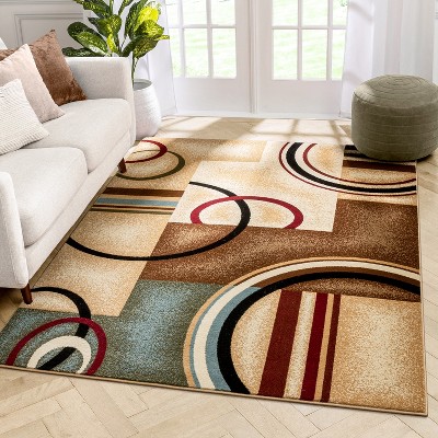 Ivory and Beige Geometric Synthetic 8' x 10' Area Rug