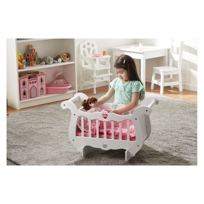 white wooden doll crib