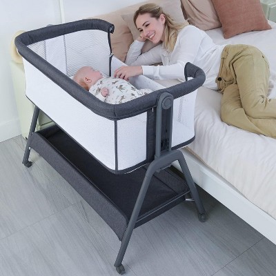 MYKKO Baby Bassinet Bedside Crib with Storage Basket and Wheels, Easy Folding Bed Side Sleeper Adjustable Height Portable Crib for Newborn